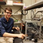 Koen Martens with the microscope he developed himself