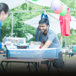 Two students are playing table tennis at the AID