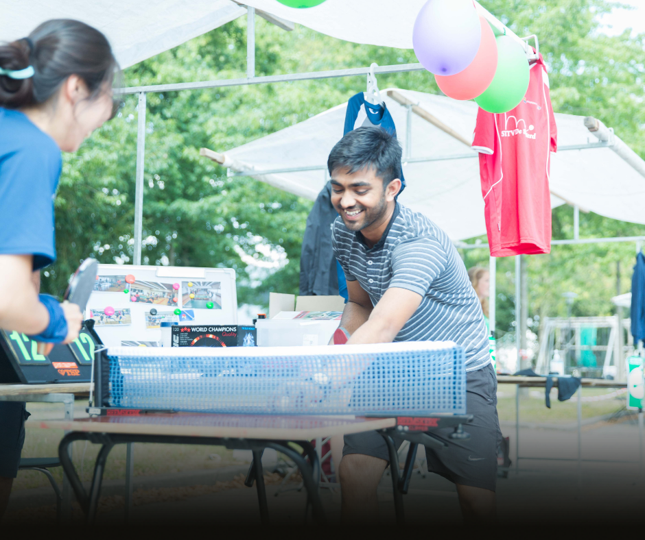 Two students are playing table tennis at the AID